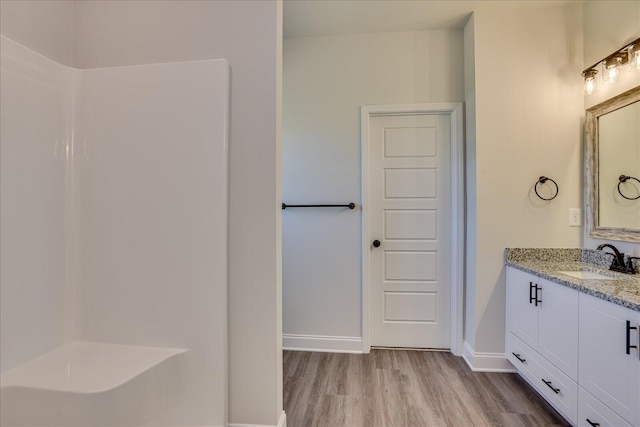 bathroom with vanity and hardwood / wood-style floors