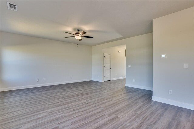 spare room featuring ceiling fan and light wood-type flooring