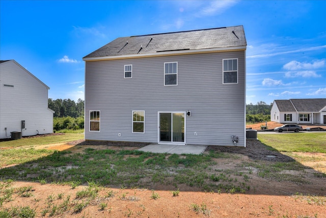 back of house with central AC and a patio