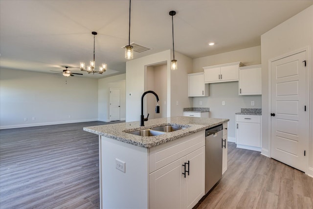 kitchen with white cabinetry, sink, stainless steel dishwasher, a center island with sink, and light wood-type flooring