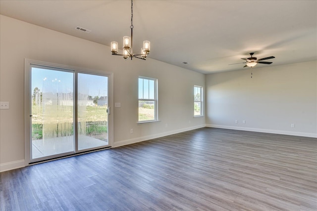 unfurnished room featuring hardwood / wood-style flooring and ceiling fan with notable chandelier