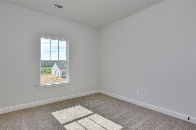 unfurnished room with carpet flooring