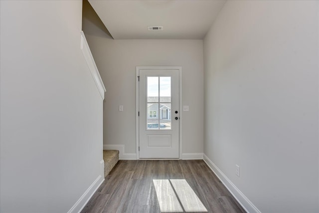 doorway to outside with dark hardwood / wood-style floors