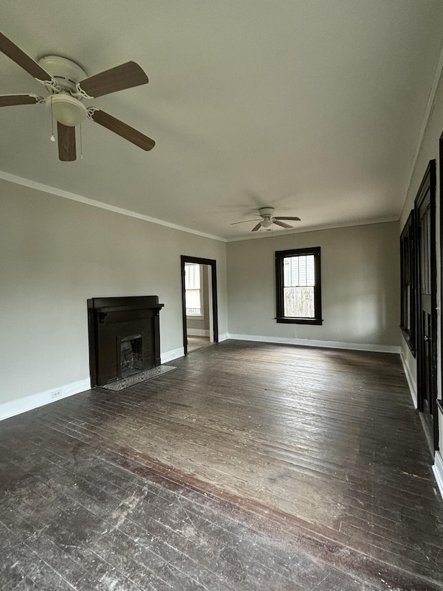 unfurnished living room featuring ceiling fan and ornamental molding