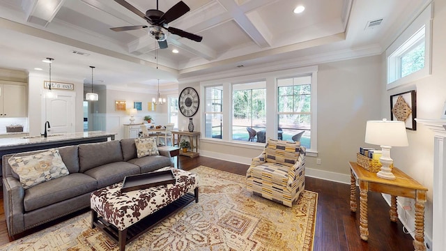 living room with beamed ceiling, wood-type flooring, coffered ceiling, and ornamental molding