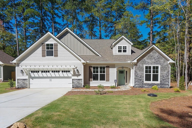 149 Cypress Dr, Mccormick, SC 29835 - craftsman-style house with concrete driveway, stone siding, a front lawn, and board and batten siding