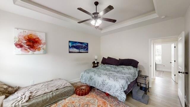 532 Nassau Pass, North Augusta, SC 29860 - bedroom with crown molding, ceiling fan, wood finished floors, and a tray ceiling