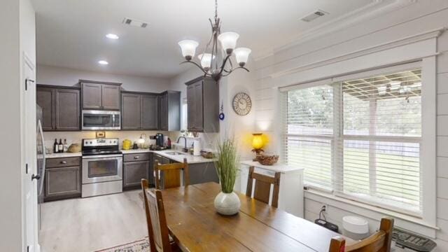 532 Nassau Pass, North Augusta, SC 29860 - kitchen with a notable chandelier, visible vents, appliances with stainless steel finishes, and light countertops