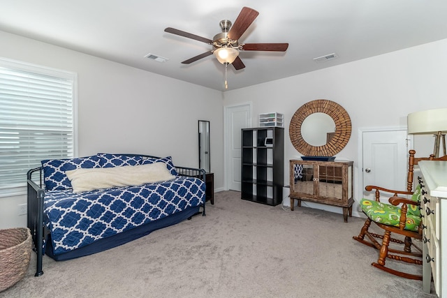 carpeted bedroom with ceiling fan