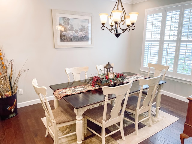 dining space with plenty of natural light, dark wood-type flooring, and an inviting chandelier