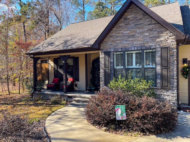 153 Cumberland Dr, Mccormick, SC 29835 - view of front of home featuring covered porch, roof with shingles, and stone siding