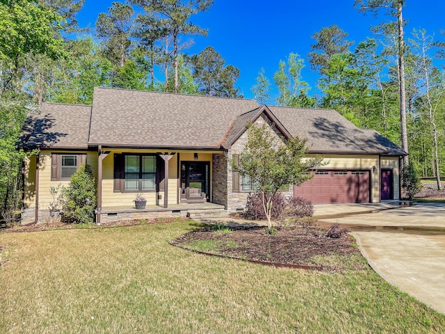 153 Cumberland Dr, Mccormick, SC 29835 - view of front of home with roof with shingles, an attached garage, a front yard, covered porch, and driveway