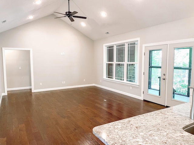 153 Cumberland Dr, Mccormick, SC 29835 - unfurnished living room with french doors, a ceiling fan, dark wood-style flooring, high vaulted ceiling, and baseboards