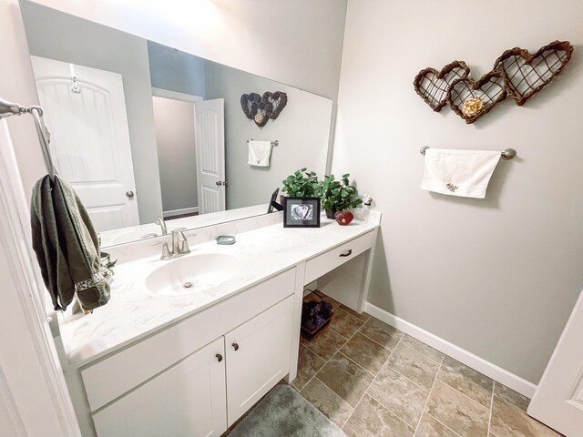 153 Cumberland Dr, Mccormick, SC 29835 - bathroom with baseboards, vanity, and stone finish flooring