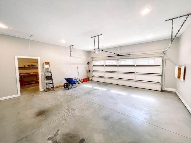 153 Cumberland Dr, Mccormick, SC 29835 - garage featuring baseboards and a garage door opener