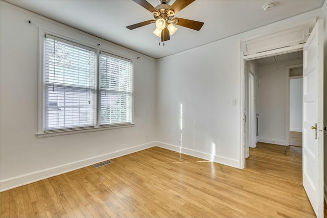 unfurnished room featuring ceiling fan and light wood-type flooring