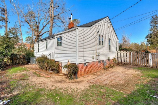 view of side of property with a patio area