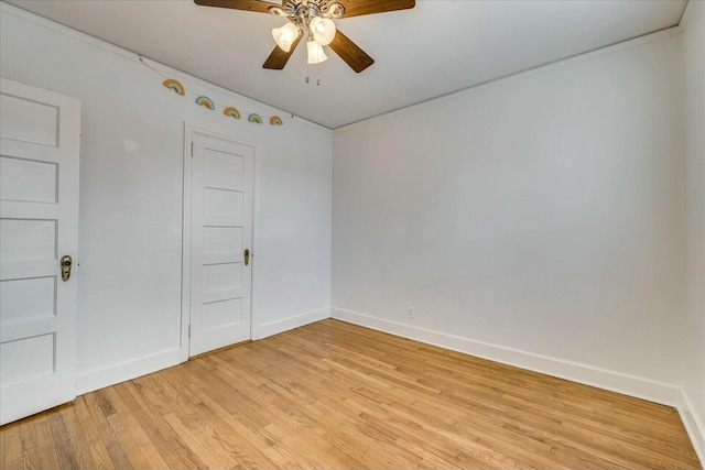 spare room featuring ceiling fan and light hardwood / wood-style floors