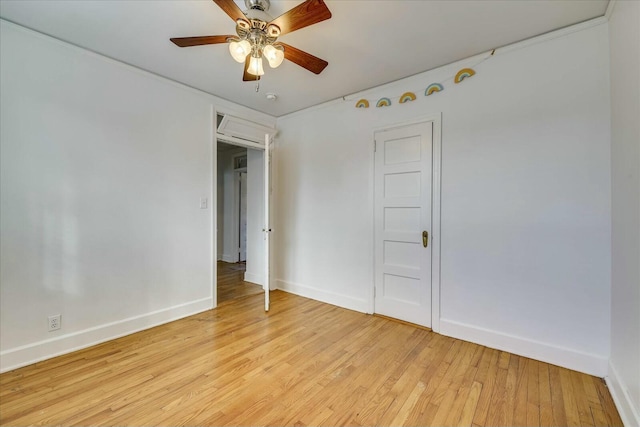 empty room with light hardwood / wood-style flooring and ceiling fan