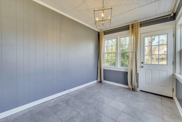 entryway featuring crown molding, plenty of natural light, wooden ceiling, and a chandelier