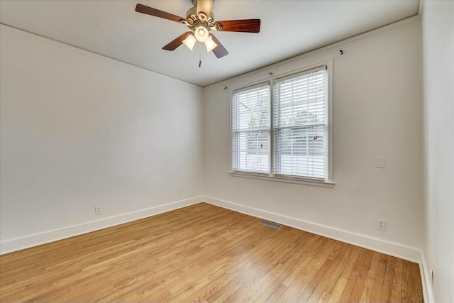 empty room featuring ceiling fan and light wood-type flooring