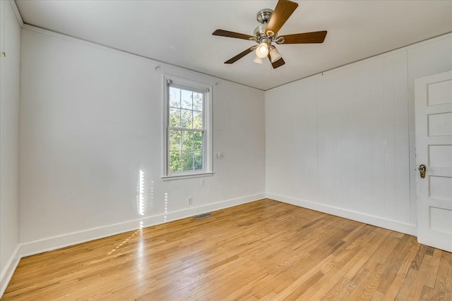 empty room featuring ceiling fan and light wood-type flooring