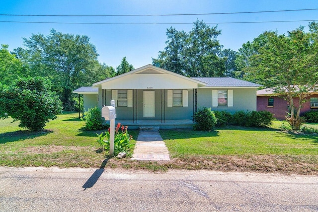 view of front of property featuring a front yard and covered porch