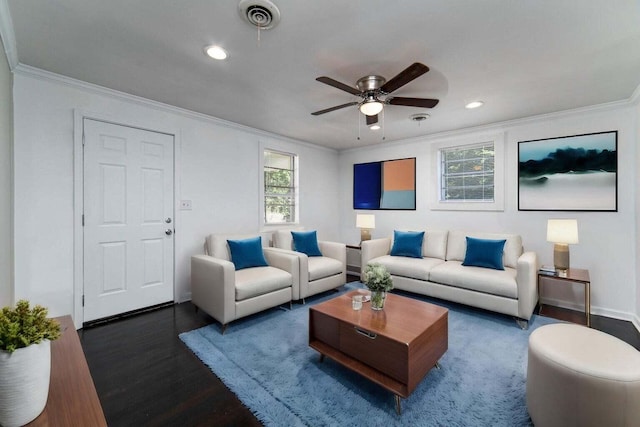 living room with ornamental molding, dark hardwood / wood-style floors, and ceiling fan