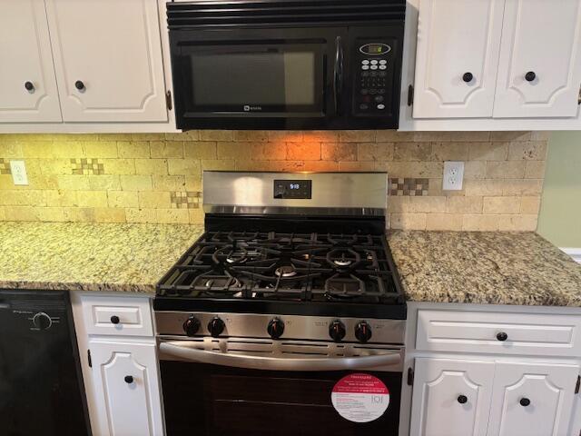 kitchen featuring backsplash, white cabinets, light stone counters, and black appliances