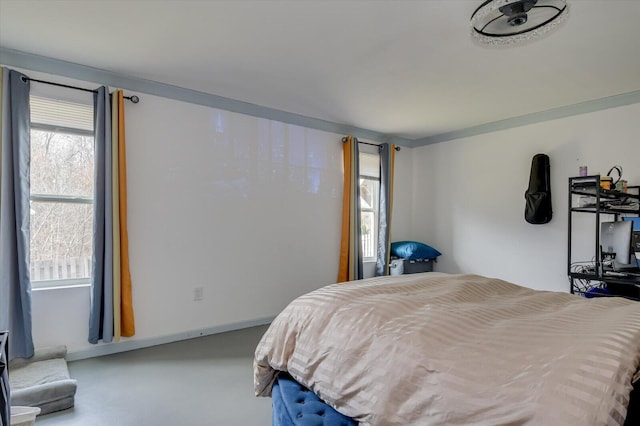 bedroom featuring finished concrete flooring