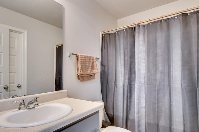 full bath with vanity and toilet