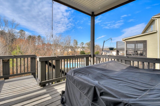 wooden deck featuring grilling area