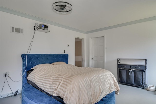 bedroom featuring visible vents and crown molding