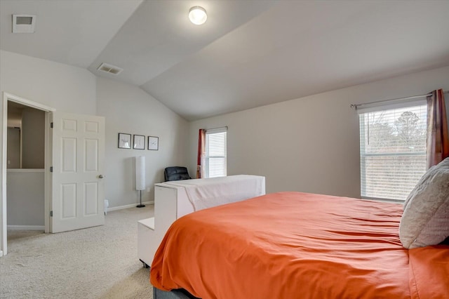 bedroom featuring light carpet, multiple windows, visible vents, and vaulted ceiling