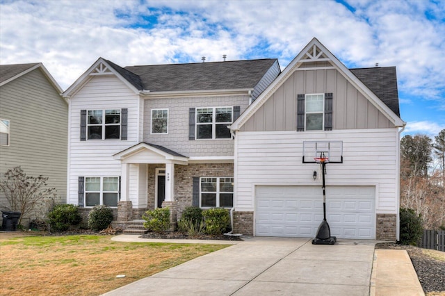 view of front of home with board and batten siding, concrete driveway, brick siding, and a front lawn