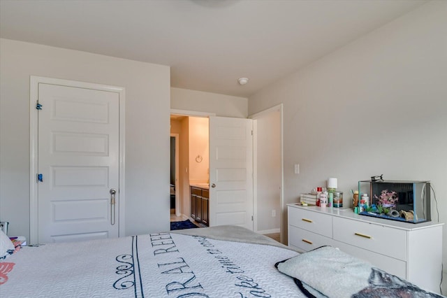 bedroom featuring connected bathroom