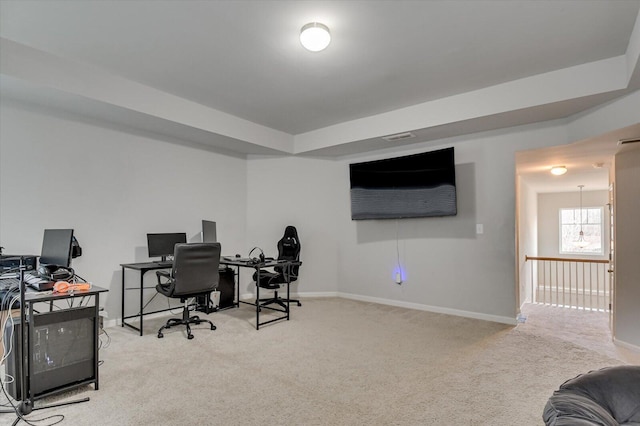 office space with light carpet and baseboards