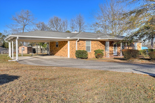 view of front facade with a carport and a front lawn