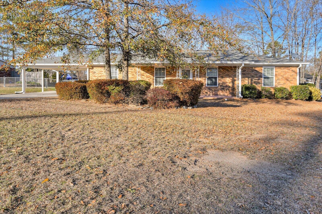 ranch-style house with a carport