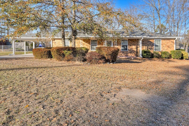 ranch-style house with a carport