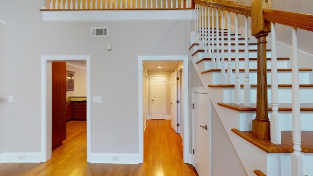 135 Coach Ln, Augusta, GA 30907 - stairs featuring visible vents, baseboards, and wood finished floors