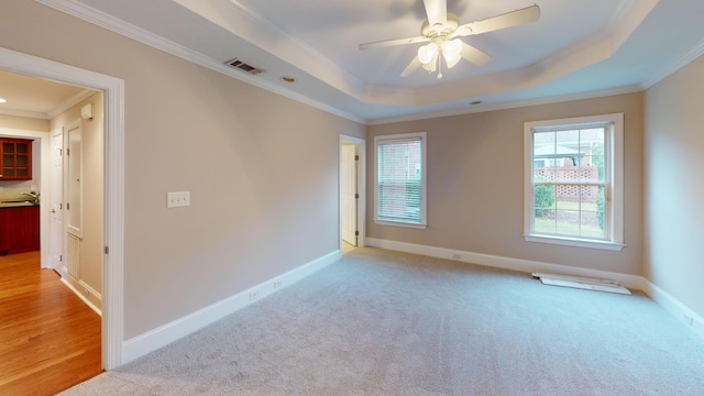 135 Coach Ln, Augusta, GA 30907 - empty room with a ceiling fan, light carpet, a raised ceiling, ornamental molding, and visible vents