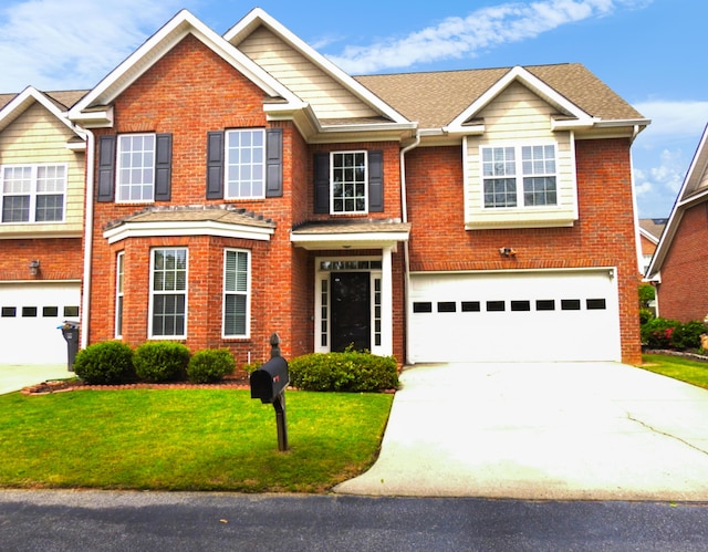 135 Coach Ln, Augusta, GA 30907 - view of front of property with a garage, a front lawn, brick siding, and concrete driveway