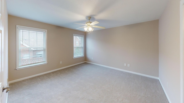 135 Coach Ln, Augusta, GA 30907 - carpeted empty room with a healthy amount of sunlight, baseboards, and ceiling fan