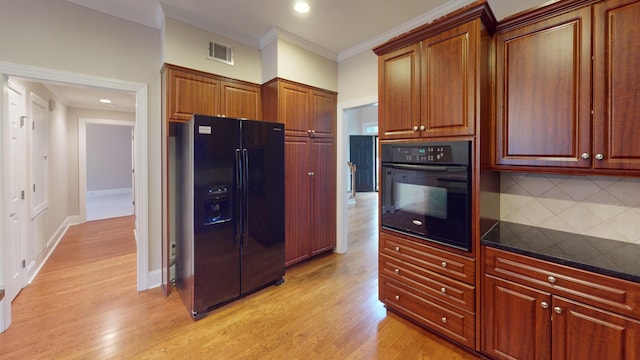 135 Coach Ln, Augusta, GA 30907 - kitchen featuring backsplash, visible vents, crown molding, black appliances, and light wood-style flooring