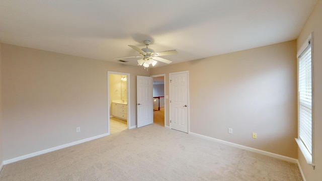 135 Coach Ln, Augusta, GA 30907 - unfurnished bedroom featuring baseboards, ensuite bath, light colored carpet, and visible vents