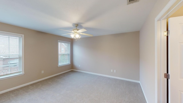 135 Coach Ln, Augusta, GA 30907 - spare room with visible vents, baseboards, light colored carpet, and ceiling fan