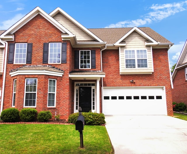 135 Coach Ln, Augusta, GA 30907 - view of front facade with brick siding, a front lawn, driveway, and a garage