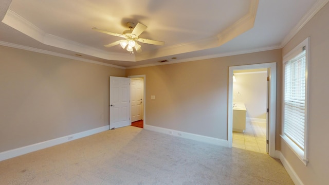 135 Coach Ln, Augusta, GA 30907 - empty room featuring a raised ceiling, a healthy amount of sunlight, and crown molding