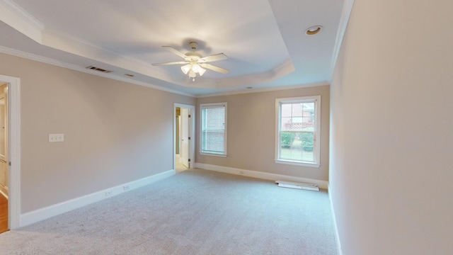 135 Coach Ln, Augusta, GA 30907 - carpeted spare room featuring a tray ceiling, visible vents, baseboards, a ceiling fan, and ornamental molding